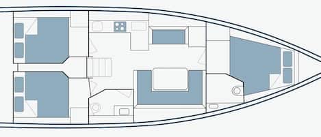 A boat interior with a kitchen, dining area, and multiple cabins.