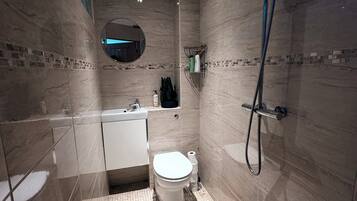 Shower, hair dryer, towels, soap