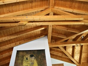 A wooden ceiling structure with visible beams and a white sheet of paper. - LuxLax 2. OG Süd Appartement/Fewo, Dusche oder Bad, WC by Interhome (Lax)