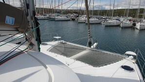 A marina with multiple sailboats docked. - Sun-Kissed Sailing Adventure in Northern Croatia (Punat)