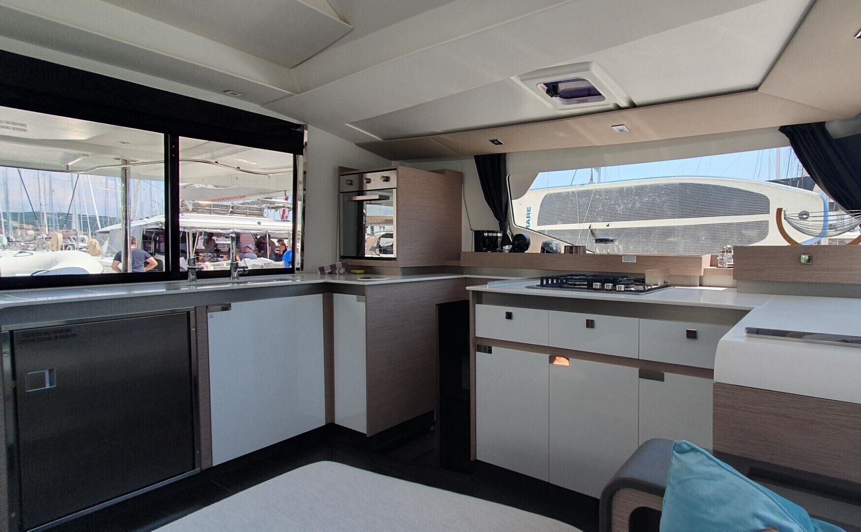 A compact galley with a stove, oven, and sink.