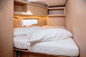A compact, well-lit sleeping area with a window, built-in storage, and a simple, functional design. - Sun-Kissed Sailing Adventure in the Sporades Islands from Volos, Thessaly (Volos)