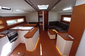 A compact kitchen with a stove, oven, and counter space. - Sun-Kissed Sailing Adventure in Sibenik, Croatia (Primošten)