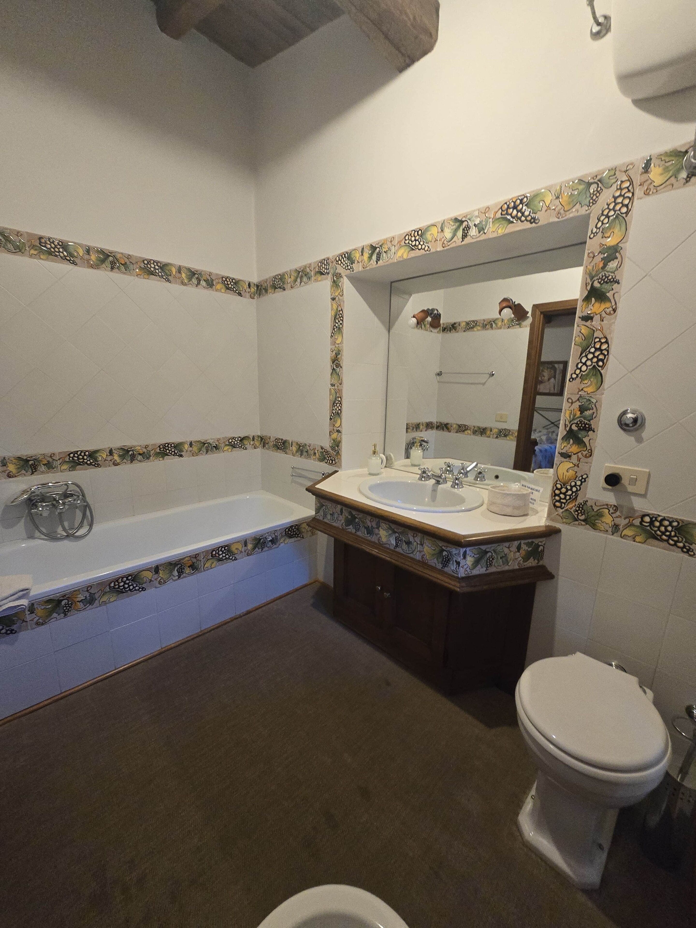 A bathroom with a bathtub, sink, and toilet.