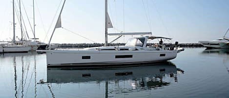 A marina with several sailboats docked.