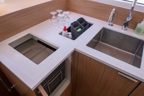 A kitchen with two sinks, a faucet, and a soap dispenser. - Sun-Kissed Sailing Adventure in the Ionian Islands, Lefkada (Lefkada)