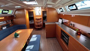 A compact galley with a bench, a small sink, and a stove. - Sun-Kissed Sailing Adventure in Zadar, Croatia (Drage)