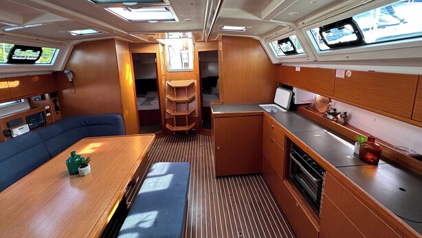 A compact galley with a bench, a small sink, and a stove. - Sun-Kissed Sailing Adventure in Zadar, Croatia (Drage)