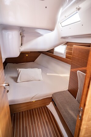 A compact, well-lit cabin with a bunk bed, a small window, and a wooden floor. - Sibenik Sun-soaked Sailing: A Luxurious Croatian Voyage (Pirovac)
