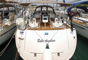 A boat named 'Bella Angelina' docked at a marina with other boats. - Sun-Kissed Sailing Adventure in Northern Croatia (Punat)