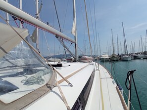 A marina with multiple sailboats docked, clear skies, and calm waters. - Sun-Kissed Sailing Adventure in the Ionian Islands, Lefkada (Lefkada)