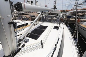 A sailboat with a cabin, deck, and visible rigging. - Sun-Kissed Sailing Adventure in Zadar, Croatia (Biograd na moru)