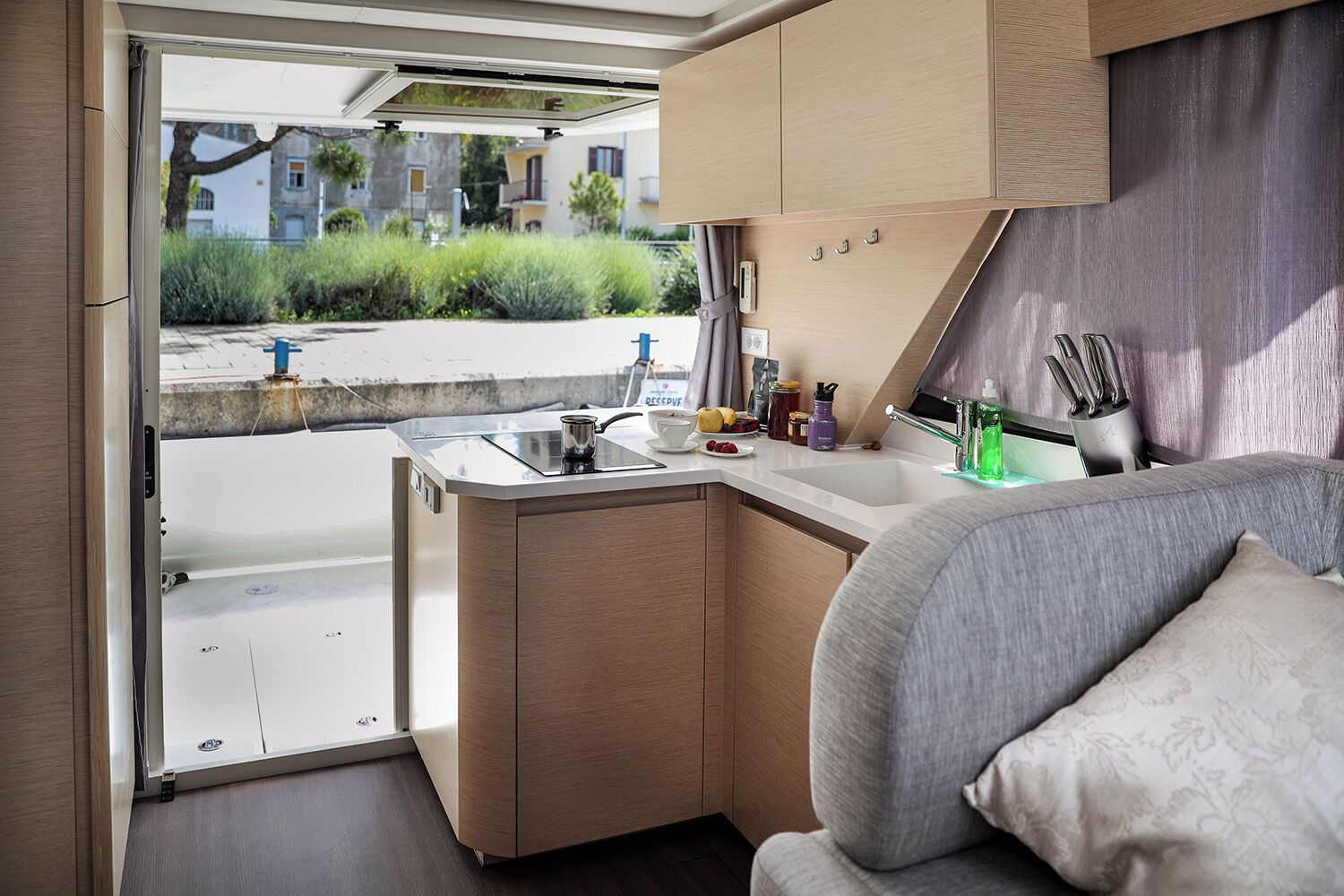 A compact kitchenette with a sink, a coffee maker, and a small countertop.
