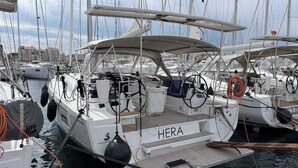 A marina with multiple sailboats docked, featuring a prominent 'HERA' name on one boat. - Sun-Kissed Sailing Adventure in Zadar, Croatia (Biograd na moru)