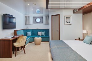 A hotel room with a bed, a desk with a chair, a sofa, a TV, and two windows with curtains. - Sun-Kissed Sailing Adventure in Split, Croatia (Split)
