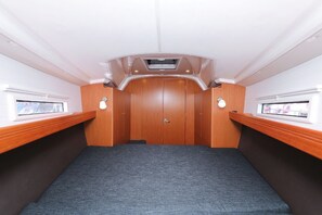 A compact room with a central door, two windows on either side, and a ceiling vent. - Sun-Kissed Sailing Adventure in Zadar, Croatia (Zadar)