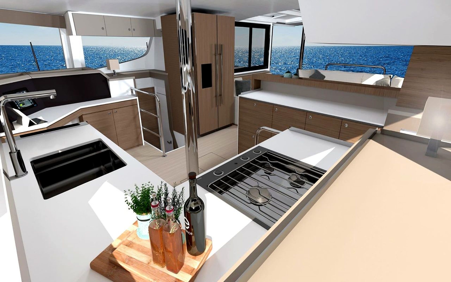 A modern kitchen with a stove, sink, and cabinets, overlooking a body of water.