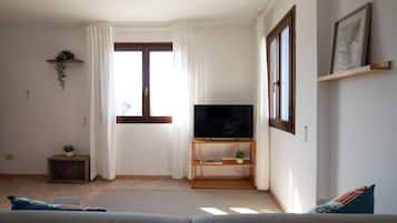Apartment, 1 Bedroom, Sea View | Living area | 30-inch TV with satellite channels