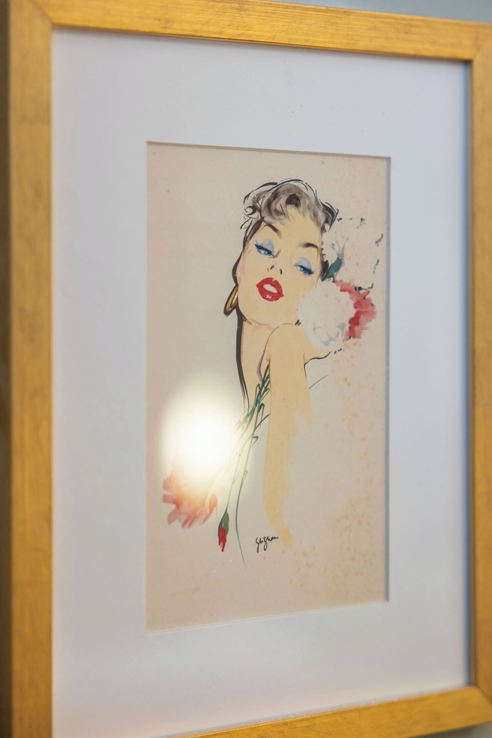 Una obra de arte enmarco con firma.