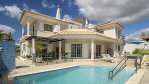 A two-story house with a swimming pool, a covered patio, and a balcony. - FU1 in Moncarapacho With 6 Bedrooms and 6 Bathrooms (Olhao)