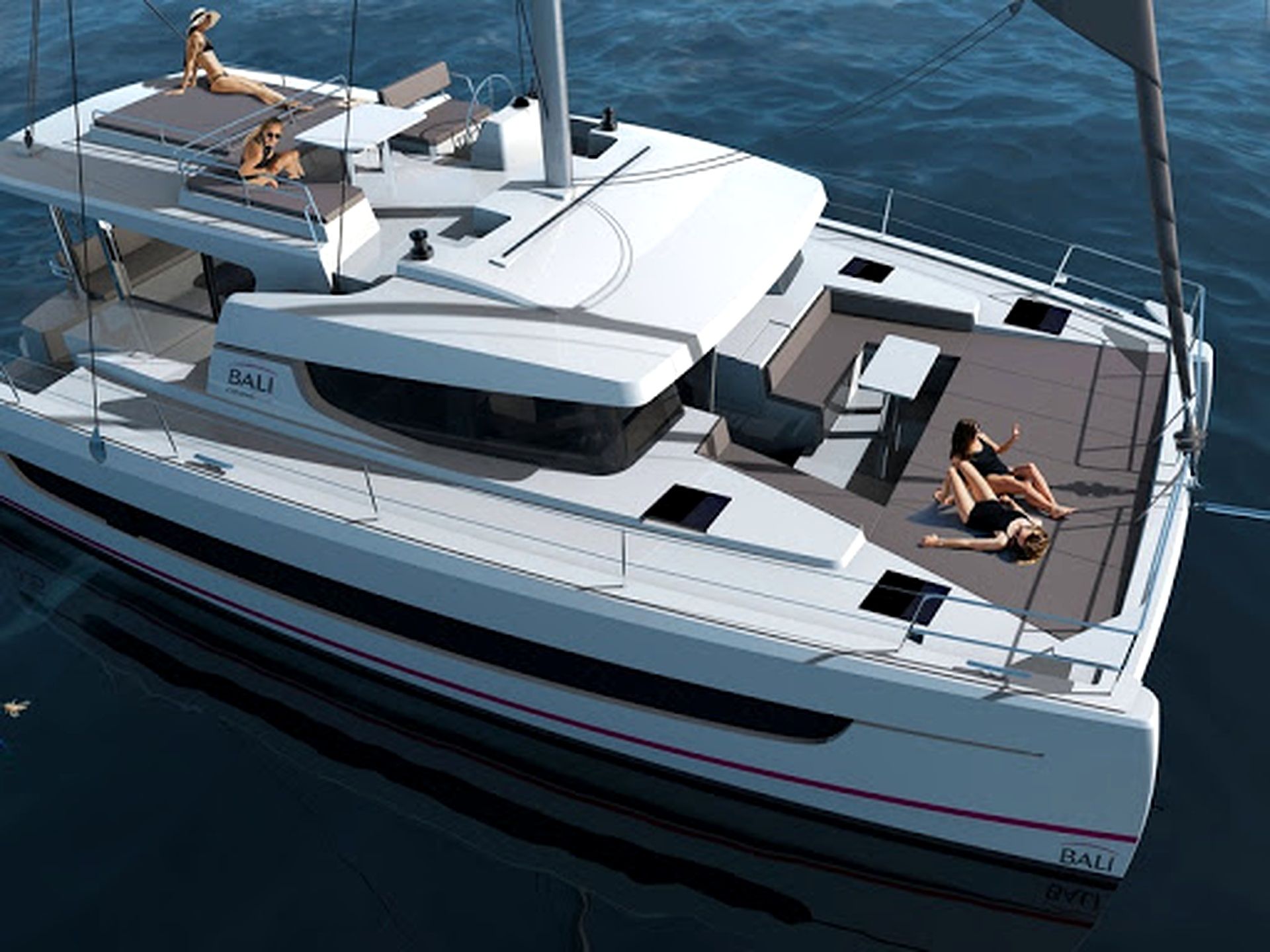 A yacht with a spacious deck, seating areas, and a name 'BALI' on the side.