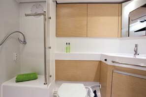 A bathroom with a shower, toilet, and sink. - Sun-kissed Sailing Adventure in Split-Dalmatia, Croatia (Seget Donji)