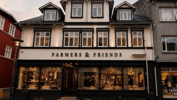 A storefront named 'Farmers & Friends' with large display windows and a traditional architectural style. - The Collector's House by Muse (Reykjavík)
