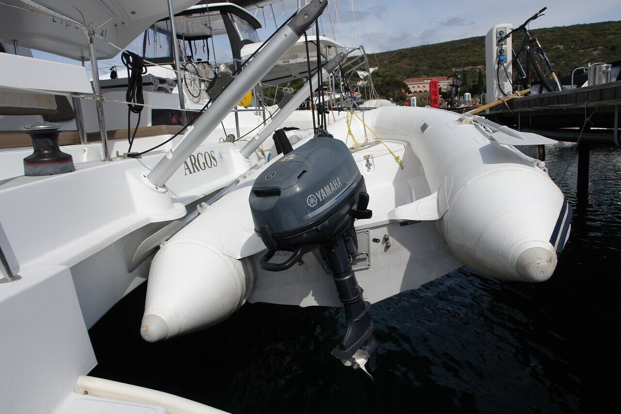 A boat with a Yamaha outboard motor, white hull, and a name 'ARGOS' on the side.