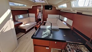 A compact galley with a stove, sink, and storage cabinets. - Sun-Kissed Sailing Adventure in Zadar, Croatia (Bibinje)