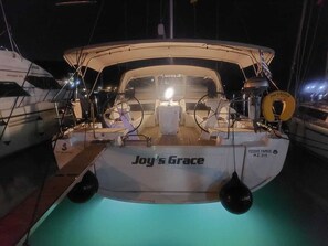 A boat named 'Joy's Grace' with a cabin, steering wheel, and a nameplate. - Sun-Kissed Sailing Adventure in the Ionian Islands, Lefkada (Lefkada)
