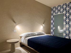 Junior Room, Partial Sea View | Minibar, in-room safe, desk, laptop workspace - Kyma Suites (PANAREA)