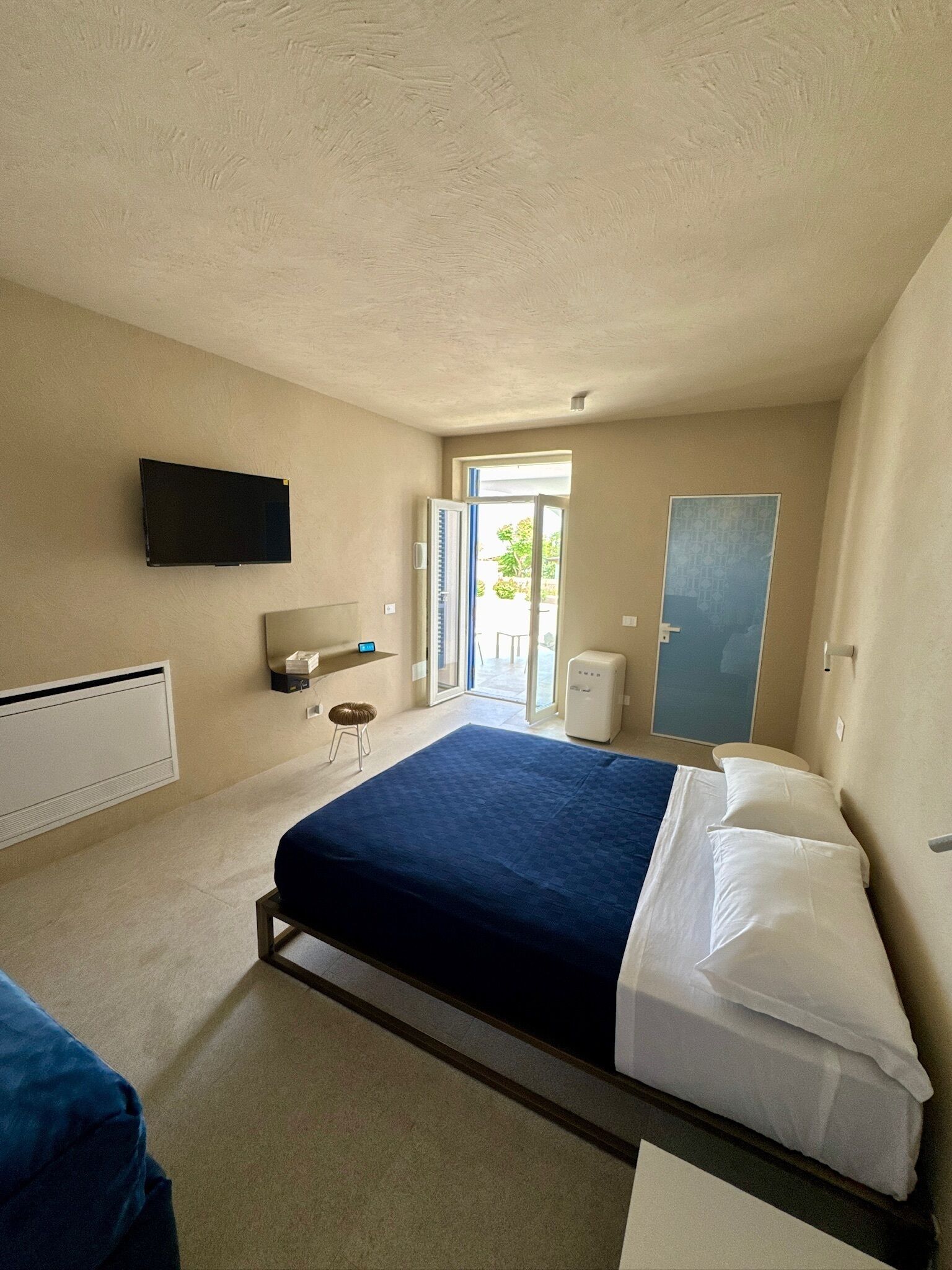 Junior Triple Room, Partial Sea View | Minibar, in-room safe, desk, laptop workspace