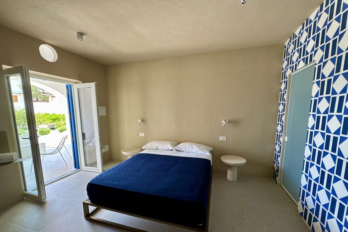 Junior Room, Partial Sea View | Minibar, in-room safe, desk, laptop workspace
