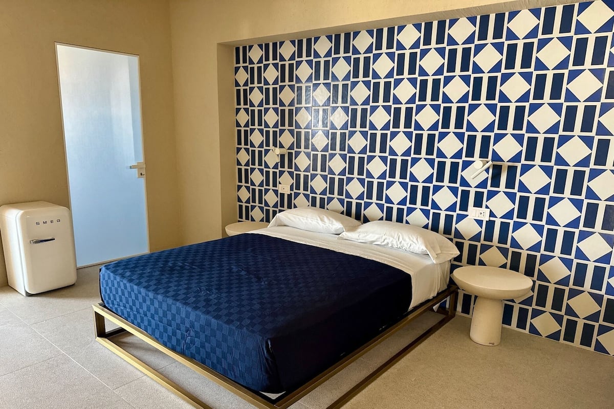 Junior Triple Room, Sea View | Minibar, in-room safe, desk, laptop workspace