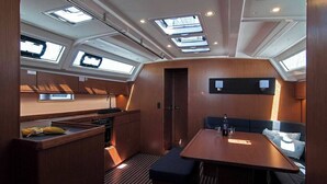 A compact galley with skylights, a small seating area, and a kitchenette. - Sun-Kissed Sailing Adventure in Split, Croatia (Split)