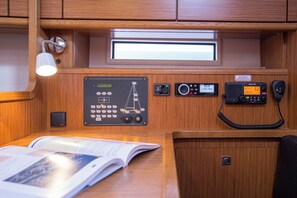 A control panel with a phone, a digital clock, and a control panel with various buttons and indicators. - Sun-Kissed Sailing Adventure in Zadar, Croatia (Zadar)