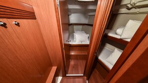 A narrow corridor with wooden walls and a bunk bed on the right. - Sun-Kissed Sailing Adventure in Zadar, Croatia (Bibinje)