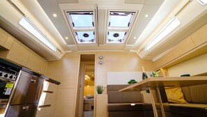 A compact kitchen with a refrigerator, stove, and skylights. - Sun-kissed Sailing Adventure in Split-Dalmatia, Croatia (Seget Donji)