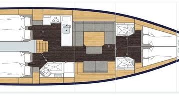 Aménagement d’un bateau comprenant un espace repas, une cuisine et des sièges.