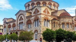 A historic building with a dome, arched windows, and a cross on top. - Sun-Kissed Sailing Adventure in Islas Sarónicas (Piraeus)