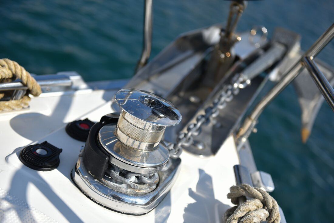 A boat's winch and ropes, indicating a sailing or boating activity.