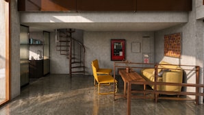 Ein modernes Interieur mit einer Treppe, einem gelben Sessel, einem Holztisch und einer Couch.