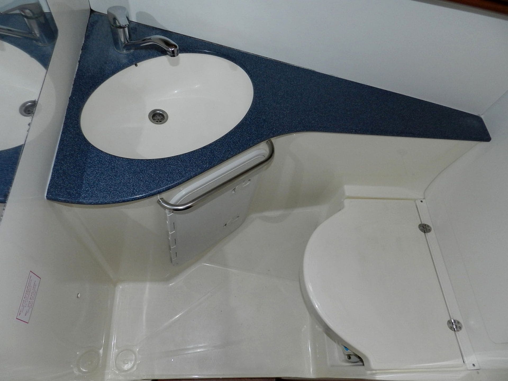 A bathroom with a white sink, a toilet, and a bathtub.