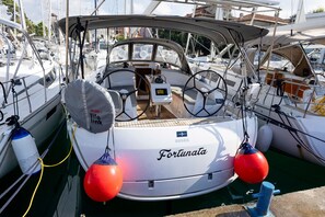 A boat named 'Fortunata' docked at a marina with multiple other boats. - Sun-Kissed Sailing Adventure in Zadar, Croatia (Zadar)