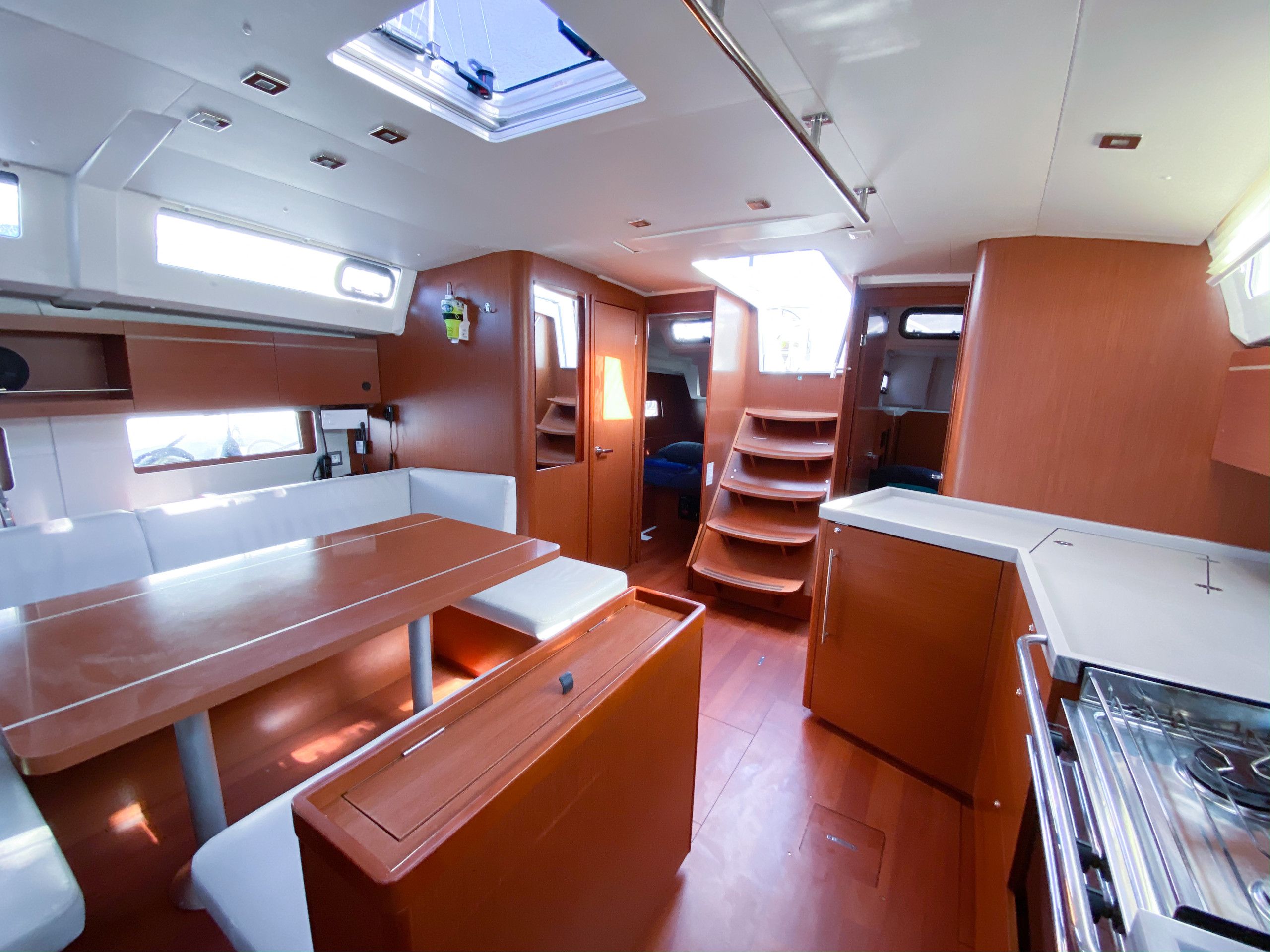 A compact kitchen with a stove, a sink, and a countertop.
