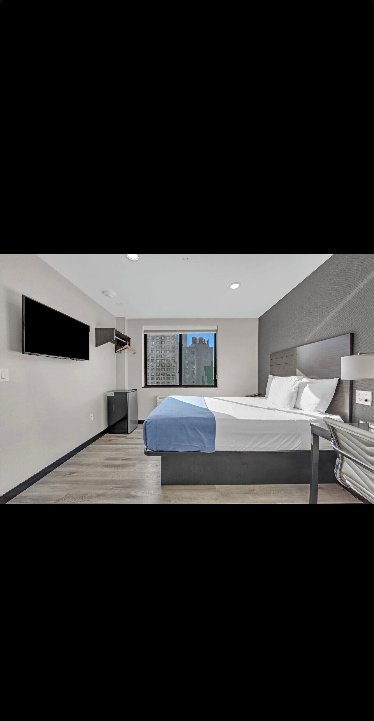Desk, laptop workspace, blackout curtains, iron/ironing board