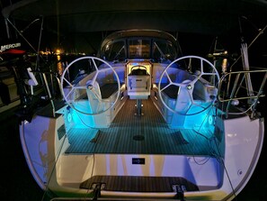 A boat's deck with steering wheels, a control panel, and a wakeboard. - Sibenik Sun-Kissed Sailing: A Luxurious Beach Experience in Croatia (Murter)