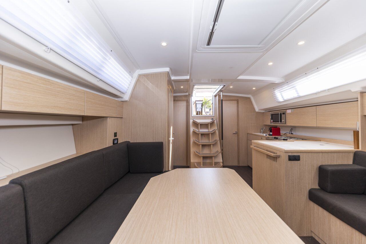 A compact kitchen with a central island, built-in cabinets, and a small countertop.