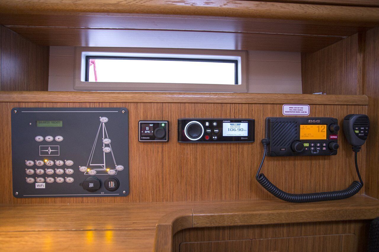 A control panel with a navigation display, a radio, and a telephone.