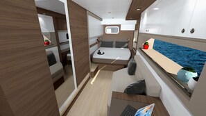 A compact interior with a bed, a small table, a window with a view of the sea, and a storage cabinet. - Sun-Kissed Sailing Adventure in the Ionian Islands, Lefkada (Lefkada)